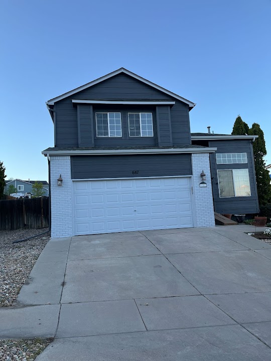 Real dark blue house exterior finish by Yovani's Repair LLC