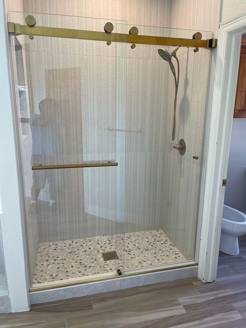 Finished custom tiled shower with frameless glass enclosure